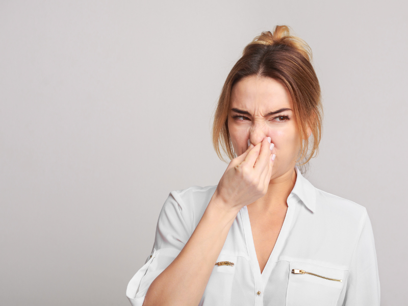 Woman Holding Her Noise