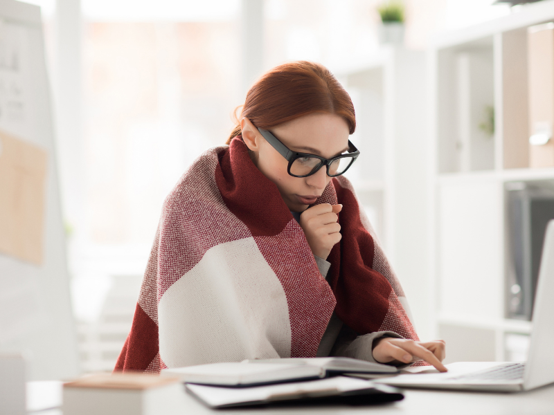 Woman wrapped in a blank reading