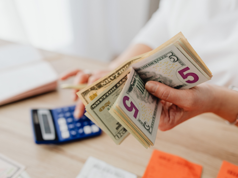 woman with money in hand